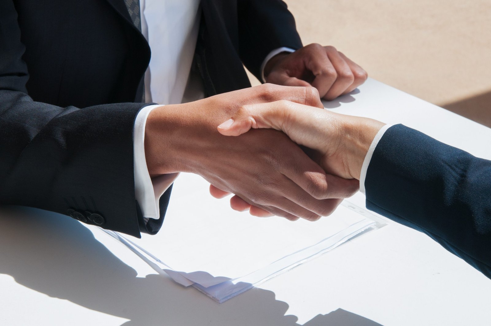 Closeup of business people shaking hands outdoors The Art of Negotiation In Morocco