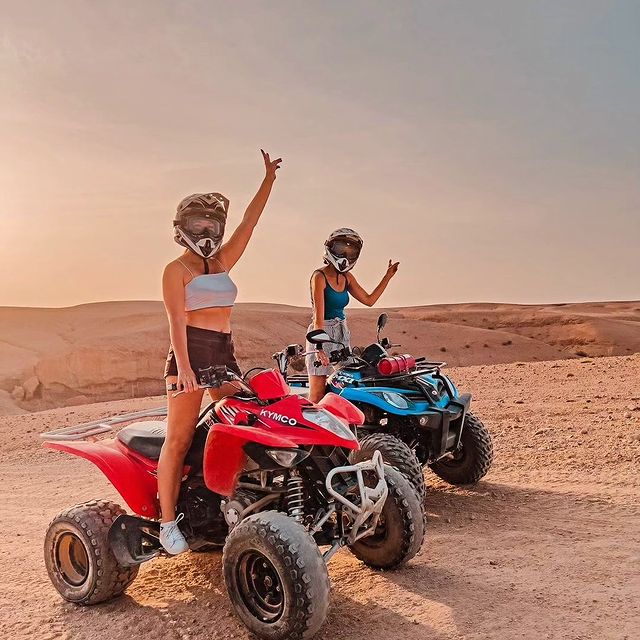 Group of travelers quad biking across rugged Agafay Desert terrain