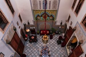 Discover why every Moroccan riad features a central patio. Explore the clever design that creates natural cooling, privacy, and a spiritual center in traditional Moroccan homes.