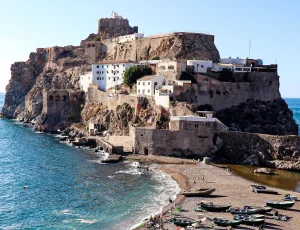 Discover Badis, Morocco's secret Mediterranean beach near Al Hoceima. Pristine waters, historic island views, and authentic fishing village charm await.