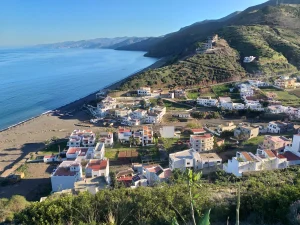Discover Jnan Nich Beach, a hidden black sand paradise in northern Morocco. Crystal clear waters, dramatic cliffs, and authentic Berber culture await.