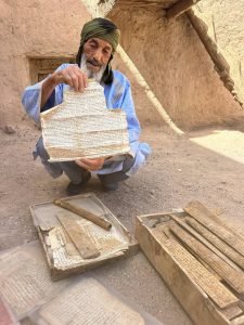 The Aït Kine collective granary is an 18th-century communal storage facility near Tata, Morocco, that serves as both a historical monument and active community center. This traditional agadir features fortress-like architecture with three levels of storage compartments around a central courtyard, built using palm tree trunks adapted to desert conditions. Beyond storage, it hosts village weddings, religious ceremonies, and gatherings, keeping Amazigh Berber traditions alive for travelers seeking authentic Moroccan heritage experiences.